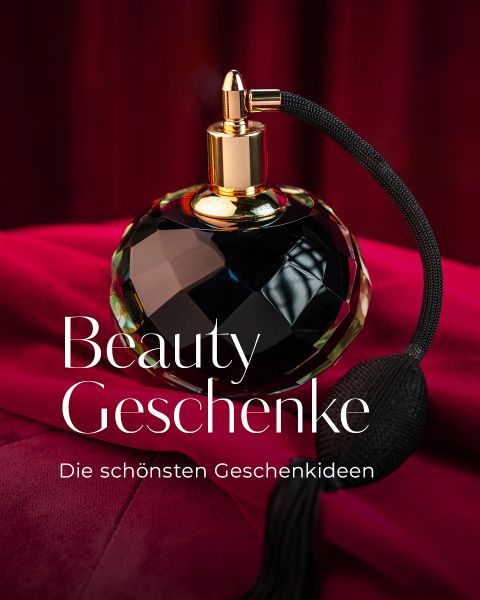 Ein schwarz-goldener Vintage-Parfümflakon steht auf rotem Stoff mit deutschem Text: "Beauty Geschenke. Die schönsten Geschenkideen.