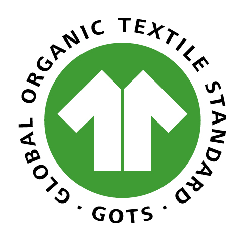 GOTS-Logo mit einem grünen Kreis und einem weißen Hemdsymbol in der Mitte. Der umlaufende Text lautet „Global Organic Textile Standard – GOTS“.
