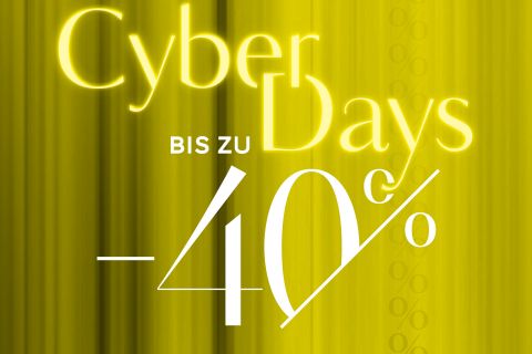 Ein leuchtend gelber und grüner Hintergrund mit dem Text „Cyber Days“ in Weiß und Gelb. Darunter steht in Weiß „BIS ZU -40%“, was auf eine Rabattaktion hinweist. Auf der rechten Seite sind vertikale Prozentsymbole schwach sichtbar.