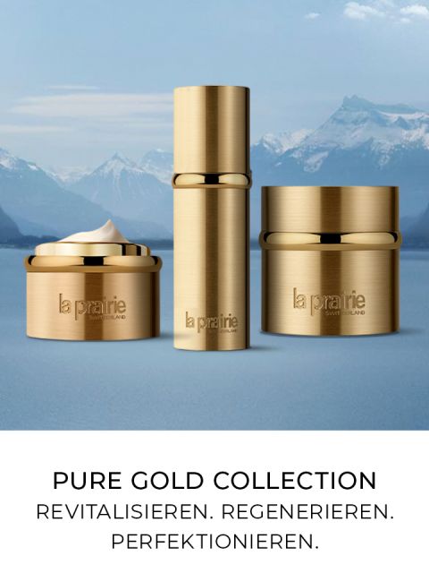 Behälter mit goldenen Deckeln der Hautpflegeprodukte der Pure Gold Collection von La Prairie werden vor einer Kulisse schneebedeckter Berge präsentiert. Der Text darunter lautet: „Pure Gold Collection. Revitalisieren. Regenerieren. Perfektionieren.“.