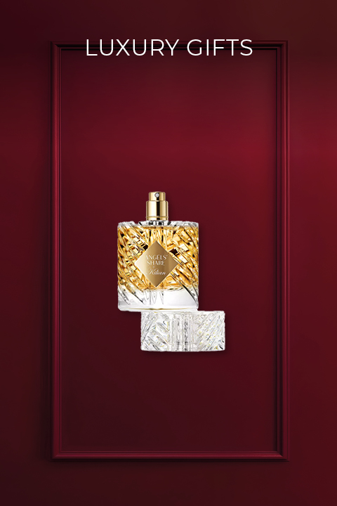 Vor einem tiefroten Hintergrund ist ein Luxusparfümflakon mit einem Design aus Gold und Kristallen zu sehen. Darunter befindet sich der Verschluss des Flakons. Darüber steht in Weiß der Text „LUXUSGESCHENKE“.