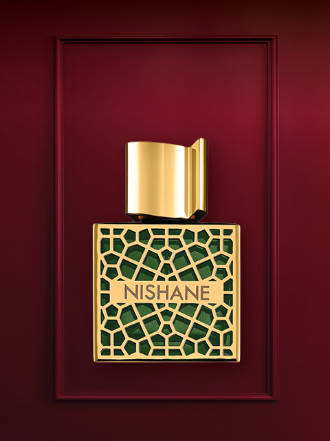 Vor einem tiefroten Hintergrund ist ein Luxusparfümflakon mit einem Design aus Gold und Kristallen zu sehen. Darunter befindet sich der Verschluss des Flakons. Darüber steht in Weiß der Text „LUXUSGESCHENKE“.