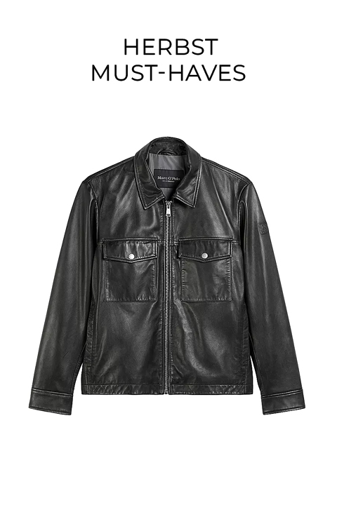 Schwarze Lederjacke mit einem Frontreißverschluss, zwei Brusttaschen mit Klappen und Knöpfen sowie langen Ärmeln. Der Text "FASHION TIPP" erscheint über der Jacke auf weißem Hintergrund.